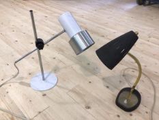 A mid century style table lamp, the conical pierced shade with black matte finish on brass effect