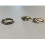 A 9ct gold eternity ring with clear stones some missing size Q and a 9ct gold ring lacking central