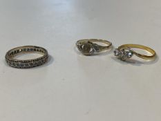 A 9ct gold eternity ring with clear stones some missing size Q and a 9ct gold ring lacking central