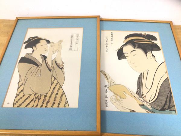 Two early 20thc Japanese prints of women reading with character marks and seals, measures 37cm x