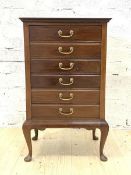 An Edwardian mahogany sheet music cabinet, with six fall front drawers, raised on cabriole supports,