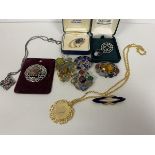 A quantity of costume and silver jewellery including brooches with polished stones, a pendant