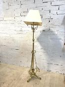 An Edwardian telescopic brass standard lamp with scrolled decoration and square tapered shade,