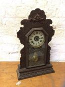 A 1920's mantel clock in moulded case, dial inscribed The Ansonia Clock Company Manufacturers USA,