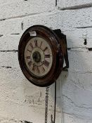 A Victorian wall clock, the white and pink dial with Roman chapter ring within a turned mahogany