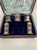 An early 20thc Birmingham silver condiment set including two pepperettes, two salts and condiment