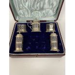 An early 20thc Birmingham silver condiment set including two pepperettes, two salts and condiment