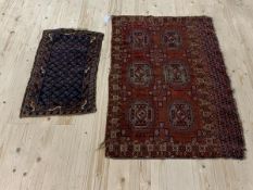 A Turkoman rug, (82cm x 122cm) together with a small Persian rug (76cm x 46cm)