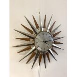 A Vintage Metamic sunburst wall clock with quartz movement, D61cm