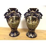 A pair of Royal Limoges early 20thc baluster shaped vases with handles to sides and matching