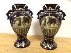 A pair of Royal Limoges early 20thc baluster shaped vases with handles to sides and matching