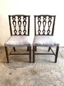 A Pair of Georgian style mahogany dining chairs, with shaped crest rail over pierced splat back,