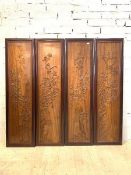 A set of four eastern hardwood wall hanging panels, carved in relief with birds and foliate, 175cm x