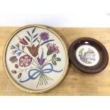 Two 1930's embroidered panels one oval with floral spray which measures 29.5cm x 24cm, the other