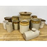 A collection of stoneware jars largest with lid measures 27cm high with 27cm diameter, also a hot