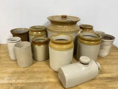 A collection of stoneware jars largest with lid measures 27cm high with 27cm diameter, also a hot