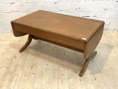 Parker Knoll, A cross banded teak sofa table, with two drop leaves, raised on four splayed supports,