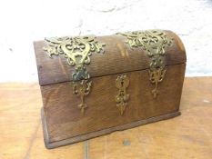 An unusual late Victorian stationery casket with domed top and pierced brass binding, possibly