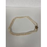 A two strand cultured pearl necklace with 9ct gold clasp with cluster of pearls measures 20cm