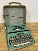 A Diplomat typewriter in original travelling case which measures 10cm x 33cm x 32 cm