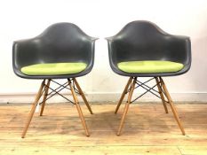 Vitra Eames, A pair of DAW chairs, with moulded and upholstered seat, raised on turned supports