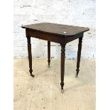 A Victorian mahogany side table, raised on turned supports with castors, H73cm, W77cm, D52cm