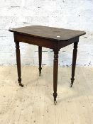 A Victorian mahogany side table, raised on turned supports with castors, H73cm, W77cm, D52cm