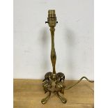A Pullman style table lamp on four cabriole supports measures 34cm high