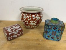 A Chinese vase of squat baluster form with red orange and ground prunus decoration, character