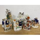 A group of 19thc Staffordshire couples including Returning Home measures 21cm high, two bud vases