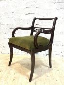 A Regency style mahogany elbow chair, with turned and pierced rails to back, drop in upholstered