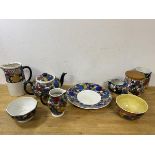A collection of studio pottery in polychrome abstract design including teapot which measures 13cm