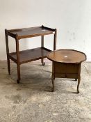 A mid 20th century mahogany two tier drinks trolley on castors, (H76cm, W69cm, D39cm) together