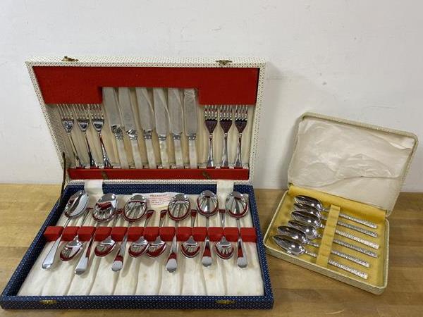 A cutlery canteen with set of six knives with mother of pearl handles, forks, spoons and