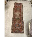 A hand knotted runner rug, probably North West Persian, of all over geometric design, 308cm x 86cm