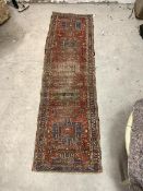 A hand knotted runner rug, probably North West Persian, of all over geometric design, 308cm x 86cm