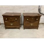 A Pair of continental oak serpentine bedside tables, each fitted with two drawers, raised on