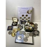 A quantity of commemorative coins including Euros, Crowns, half Dollar, two commemorative coins with
