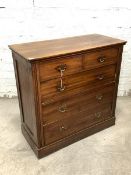 An Edwardian walnut chest, fitted with two short and three long graduated drawers, raised on a