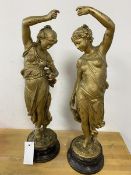 Two cast metal figures of girls dancing, some losses, gilt finish, measures 47cm high