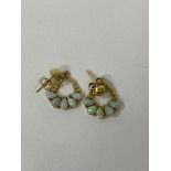 A pair of yellow metal opal set earrings measure 1cm across, 1 back marked 14 the other 18