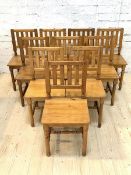 John Lewis of Hungerford, A set of eleven pitch pine farmhouse style dining chairs, the rail backs