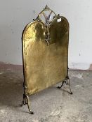 An Edwardian cast and hammered brass fire screen, H77cm