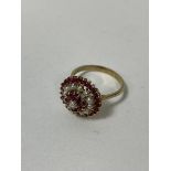 A pearl and ruby cluster ring with 9ct gold mount and shank size R/S