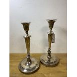 A pair of 1918 Sheffield silver baluster shaped candlesticks, makers mark HE Ltd, each measures 30cm