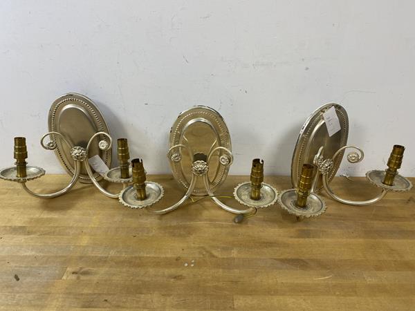 A set of three two-arm wall sconces with silvered finish, each measures 20cm high