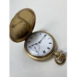 A late 19th early 20thc full hunter pocket watch, face inscribed The Angus, yellow metal case