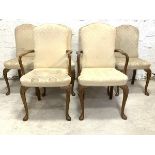 A Set of six (4+2) early 20th century Queen Anne style walnut dining chairs, upholstered in ivory