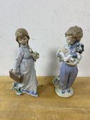 Two Lladro figures, one of boy holding puppy the other of girl with bouquet and travelling case,