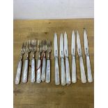 A set of six 1928 fruit knives and forks with mother of pearl handles and Mappin and Webb